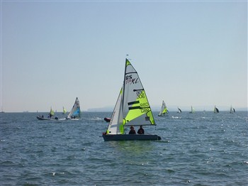 Sail boat lots of water and sky